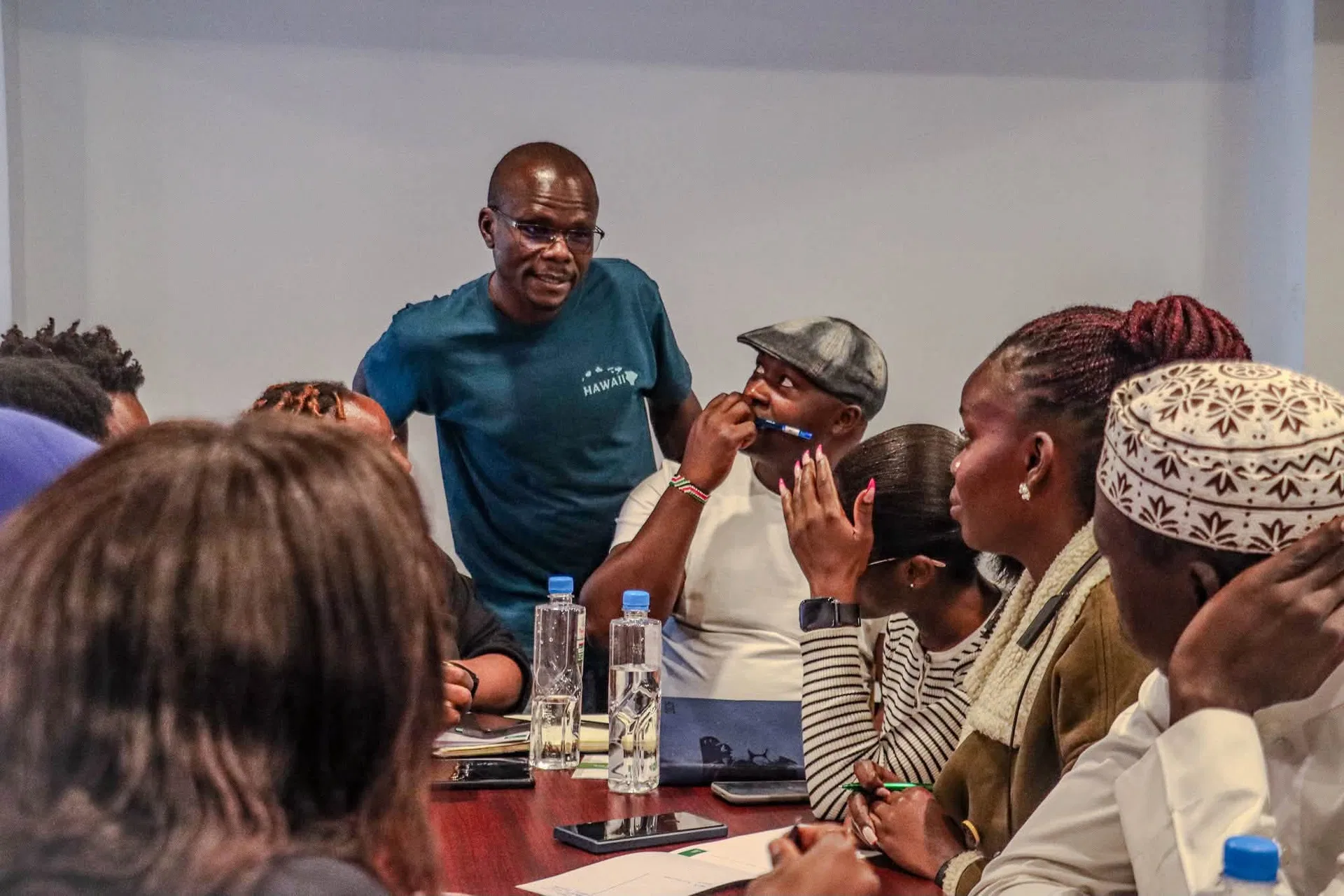 A woman speaks to participants during a Siasa Place workshop.